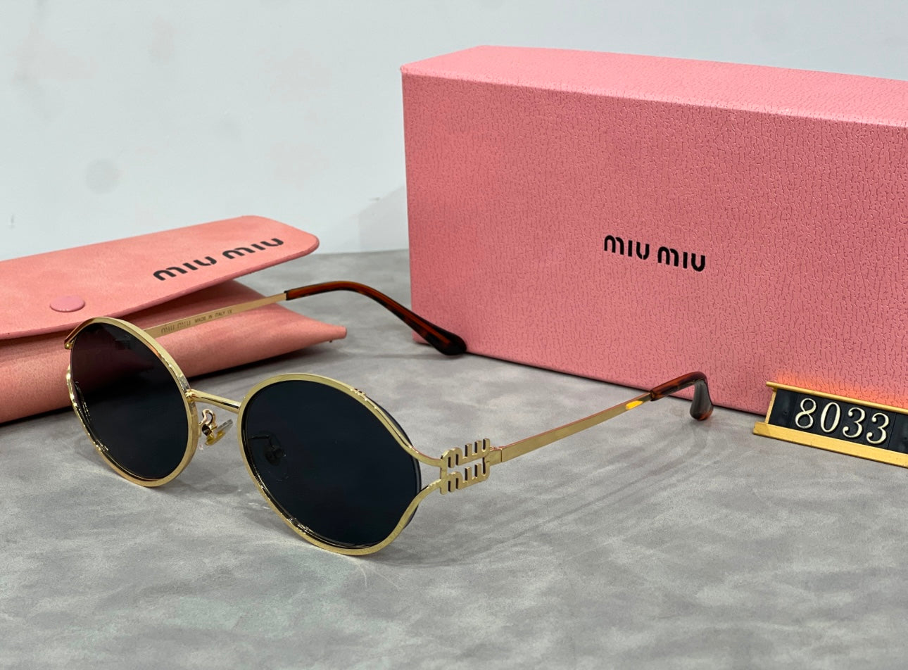 Black with gold miu sunglasses