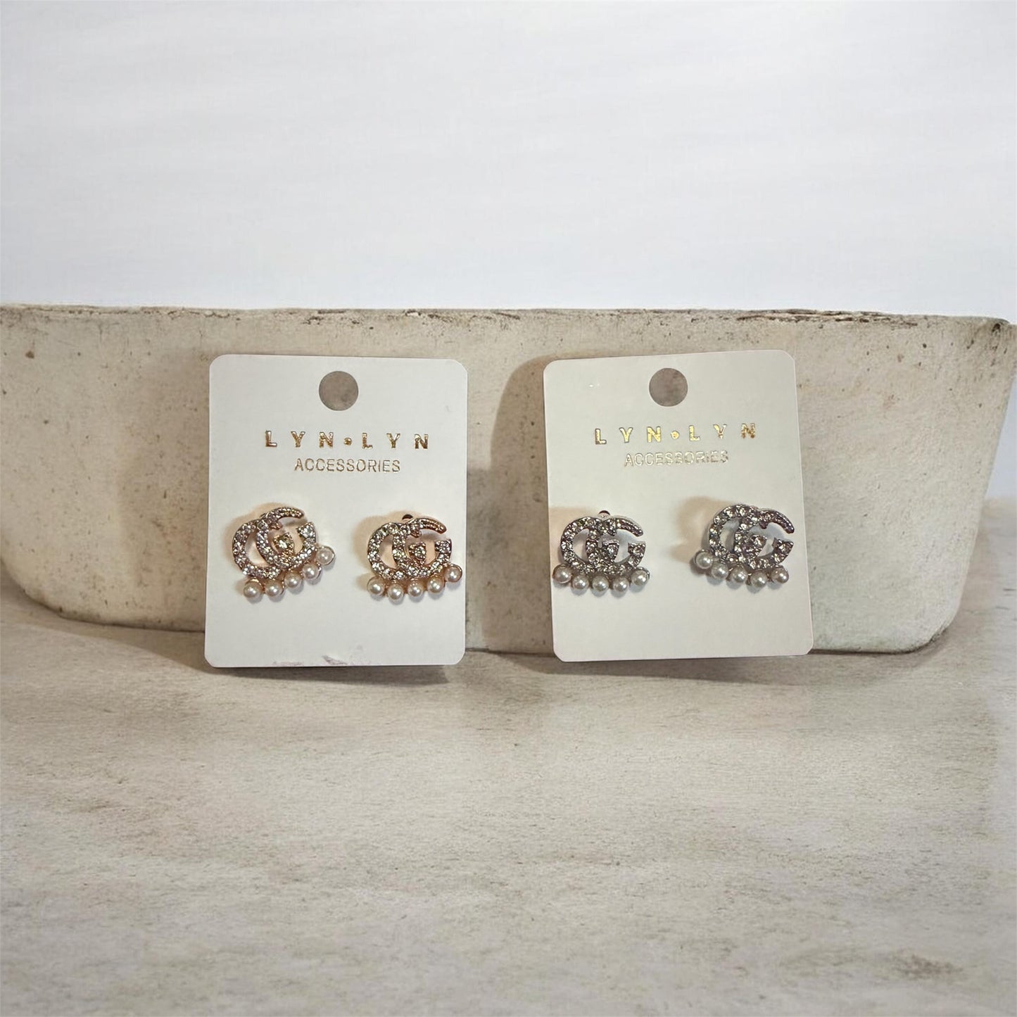 Gg on pearl earrings